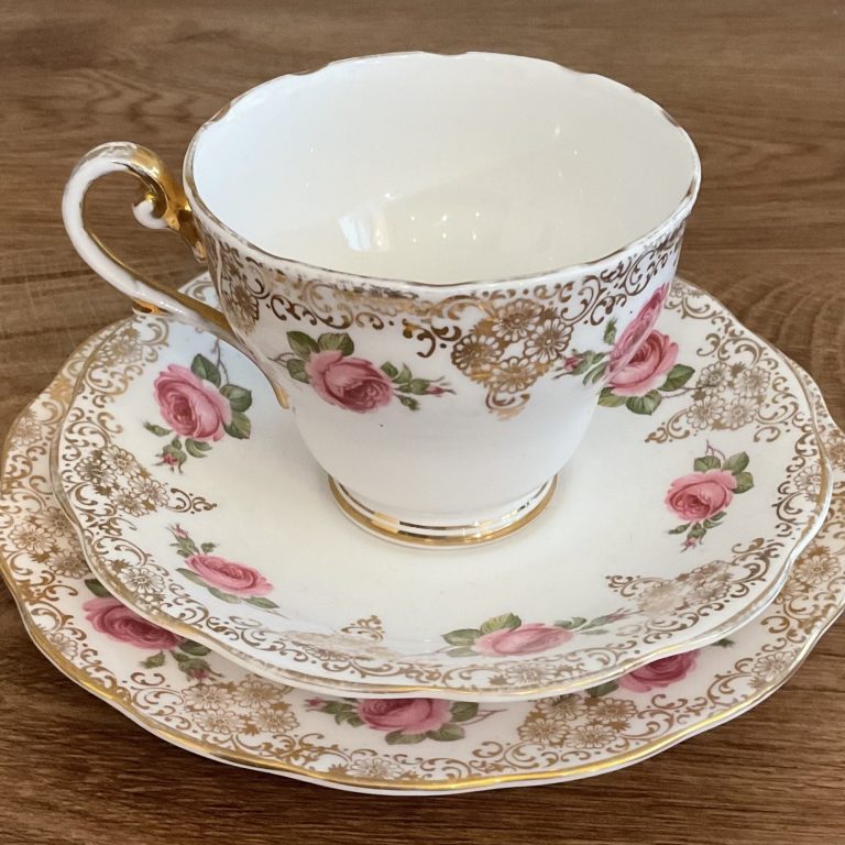 A tea cup, saucer and side plate trio