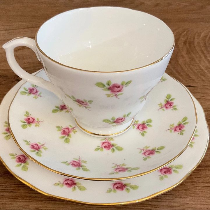 A tea cup, saucer and side plate trio